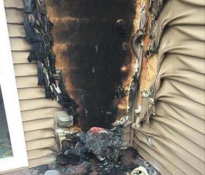 The siding of a home badly burned