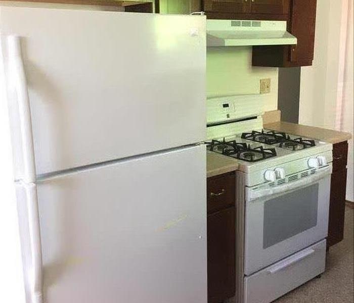 A brand new refrigerator and stove